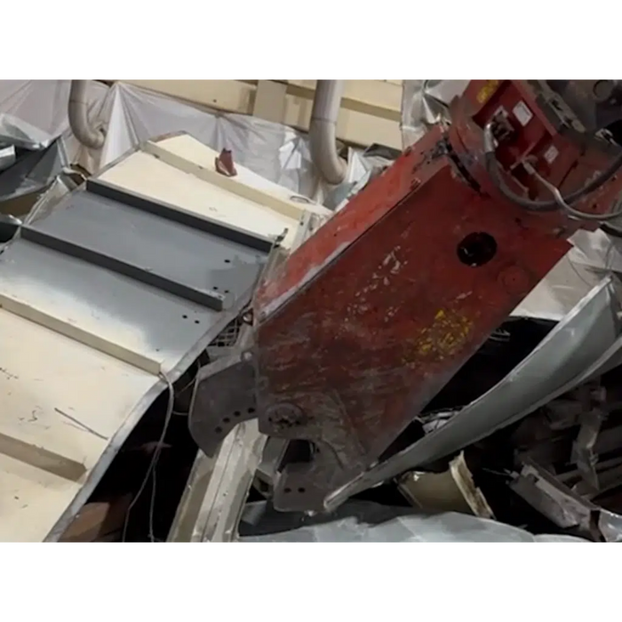 Demolition shears cutting through metal materials