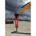 Red hydraulic breaker attached to a yellow excavator against a cloudy sky.