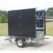 Mobile solar security camera trailer with solar panels on a trailer in an outdoor setting