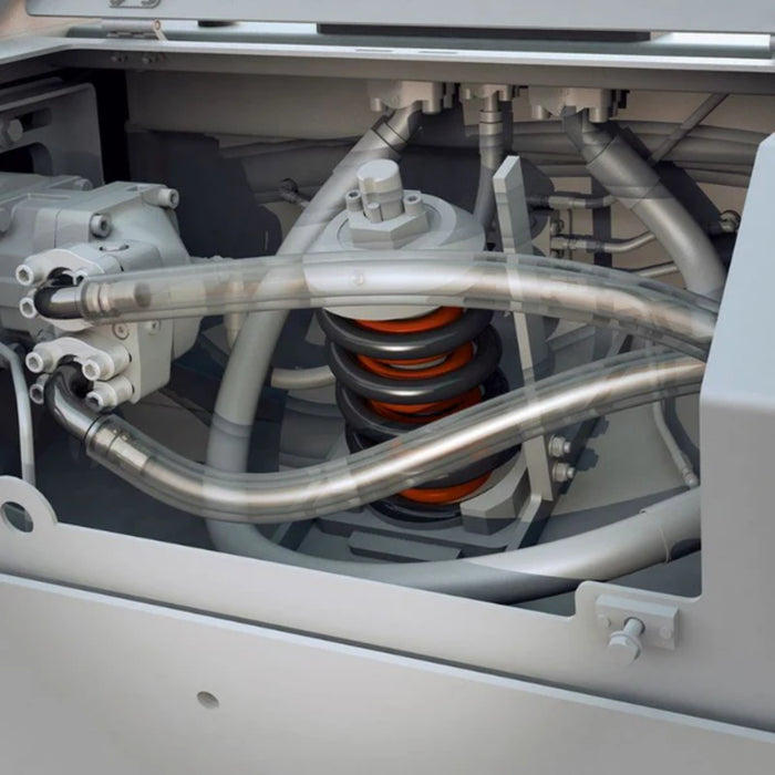 Close-up of mechanical components with pipes and springs inside a machine.